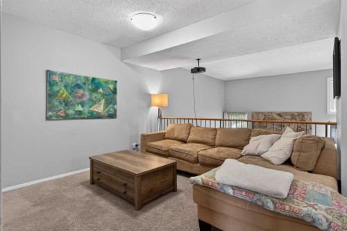 53 Millrise Lane Sw, Calgary, AB - Indoor Photo Showing Living Room