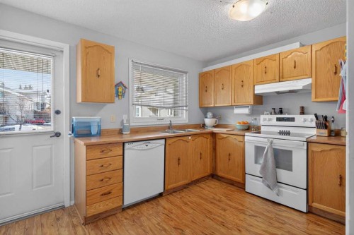 53 Millrise Lane Sw, Calgary, AB - Indoor Photo Showing Kitchen With Double Sink