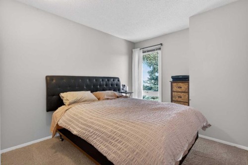 53 Millrise Lane Sw, Calgary, AB - Indoor Photo Showing Bedroom