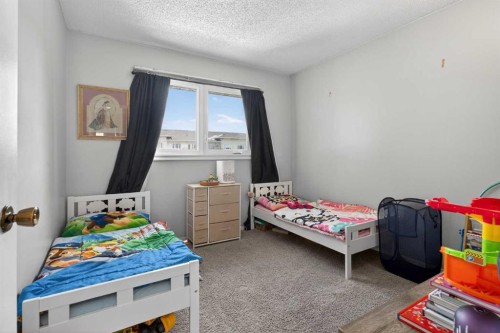 53 Millrise Lane Sw, Calgary, AB - Indoor Photo Showing Bedroom