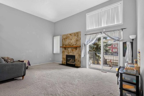 53 Millrise Lane Sw, Calgary, AB - Indoor With Fireplace