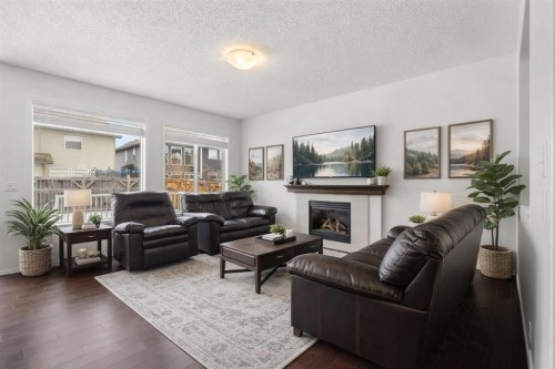 182 Auburn Sound Close Se, Calgary, AB - Indoor Photo Showing Living Room With Fireplace