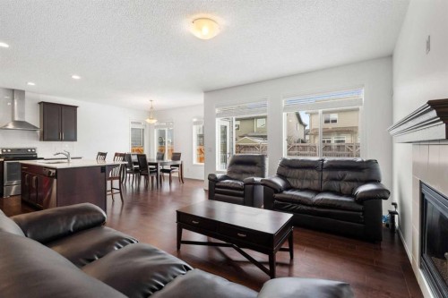 182 Auburn Sound Close Se, Calgary, AB - Indoor Photo Showing Living Room With Fireplace