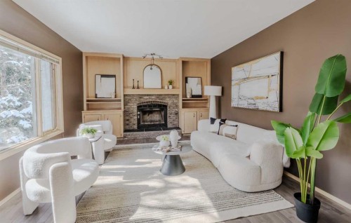 135 Canterbury Court Sw, Calgary, AB - Indoor Photo Showing Living Room With Fireplace