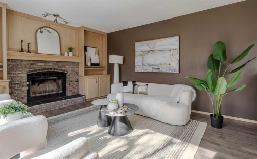 135 Canterbury Court Sw, Calgary, AB - Indoor Photo Showing Living Room With Fireplace