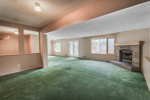 135 Canterbury Court Sw, Calgary, AB - Indoor With Fireplace