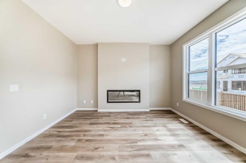 1085 Sawgrass Link Nw, Airdrie, AB - Indoor With Fireplace