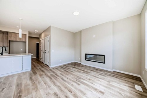 1085 Sawgrass Link Nw, Airdrie, AB - Indoor With Fireplace