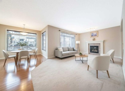 107 Panatella Close Nw, Calgary, AB - Indoor Photo Showing Living Room With Fireplace