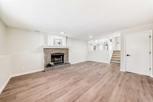624 Shawinigan Drive Sw, Calgary, AB - Indoor Photo Showing Living Room With Fireplace