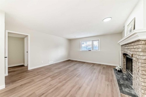 624 Shawinigan Drive Sw, Calgary, AB - Indoor With Fireplace