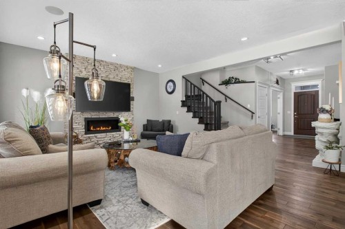 264 Stonemere Close, Chestermere, AB - Indoor Photo Showing Living Room With Fireplace
