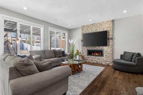 264 Stonemere Close, Chestermere, AB - Indoor Photo Showing Living Room With Fireplace