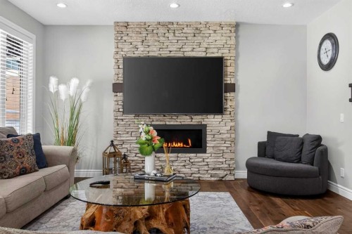 264 Stonemere Close, Chestermere, AB - Indoor Photo Showing Living Room With Fireplace