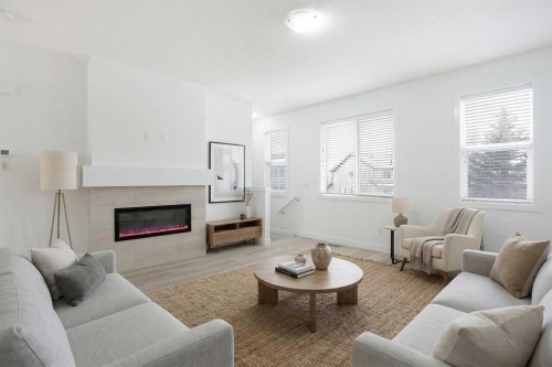 438 Copperstone Manor Se, Calgary, AB - Indoor Photo Showing Living Room With Fireplace