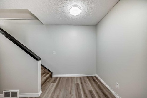 2-7 Westland Road, Okotoks, AB - Indoor Photo Showing Other Room