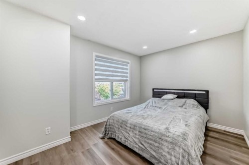 2-7 Westland Road, Okotoks, AB - Indoor Photo Showing Bedroom