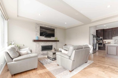84 Aspen Summit Circle Sw, Calgary, AB - Indoor Photo Showing Living Room With Fireplace