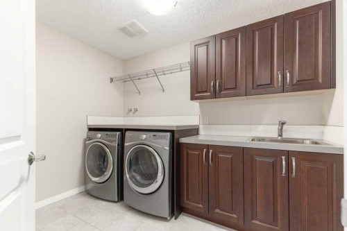 84 Aspen Summit Circle Sw, Calgary, AB - Indoor Photo Showing Laundry Room