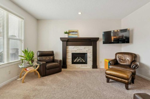 1173 Brightoncrest Common Se, Calgary, AB - Indoor Photo Showing Other Room With Fireplace