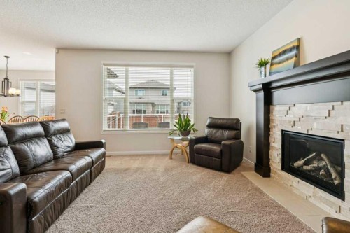 1173 Brightoncrest Common Se, Calgary, AB - Indoor Photo Showing Living Room With Fireplace
