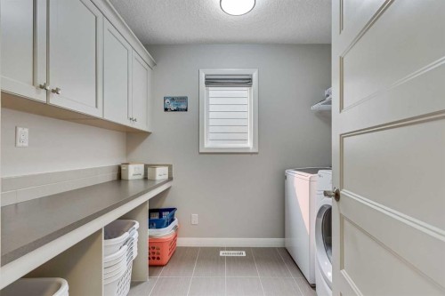 55 Sage Bluff Green Nw, Calgary, AB - Indoor Photo Showing Laundry Room