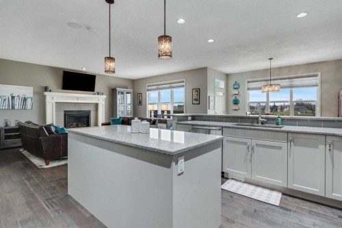 55 Sage Bluff Green Nw, Calgary, AB - Indoor Photo Showing Kitchen With Fireplace