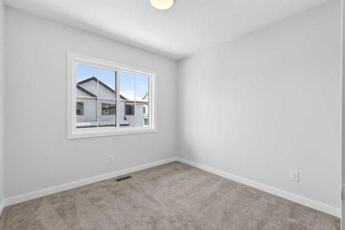 121-1750 Rangeview Drive Se, Calgary, AB - Indoor Photo Showing Other Room