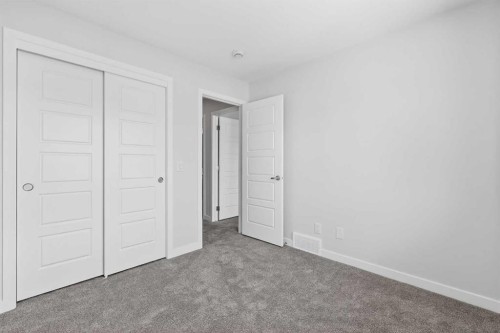 121-1750 Rangeview Drive Se, Calgary, AB - Indoor Photo Showing Other Room