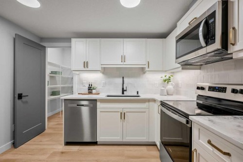 45 Wolf Hollow Common Se, Calgary, AB - Indoor Photo Showing Kitchen With Upgraded Kitchen