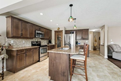 23 Kingston View Se, Airdrie, AB - Indoor Photo Showing Kitchen With Stainless Steel Kitchen With Upgraded Kitchen