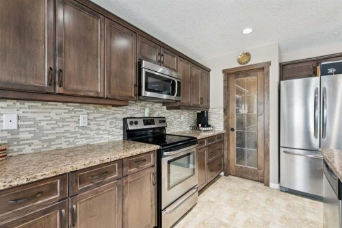 23 Kingston View Se, Airdrie, AB - Indoor Photo Showing Kitchen With Stainless Steel Kitchen