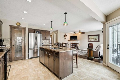 23 Kingston View Se, Airdrie, AB - Indoor Photo Showing Kitchen With Stainless Steel Kitchen With Double Sink With Upgraded Kitchen