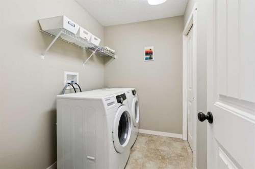 23 Kingston View Se, Airdrie, AB - Indoor Photo Showing Laundry Room