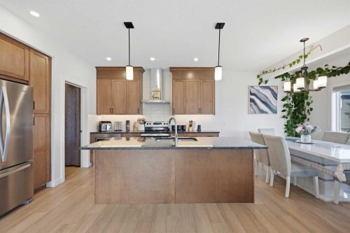 1448 Bayview Point Sw, Airdrie, AB - Indoor Photo Showing Kitchen With Upgraded Kitchen