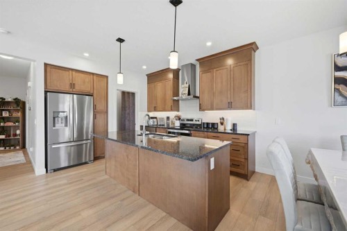 1448 Bayview Point Sw, Airdrie, AB - Indoor Photo Showing Kitchen With Upgraded Kitchen