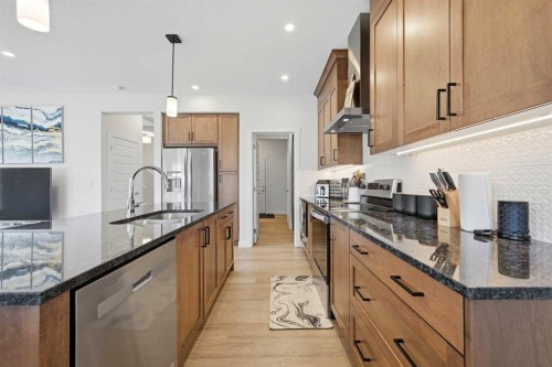 1448 Bayview Point Sw, Airdrie, AB - Indoor Photo Showing Kitchen With Double Sink With Upgraded Kitchen