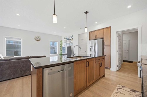 1448 Bayview Point Sw, Airdrie, AB - Indoor Photo Showing Kitchen With Double Sink With Upgraded Kitchen