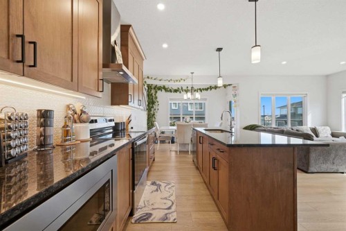 1448 Bayview Point Sw, Airdrie, AB - Indoor Photo Showing Kitchen With Upgraded Kitchen