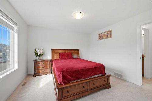 1448 Bayview Point Sw, Airdrie, AB - Indoor Photo Showing Bedroom