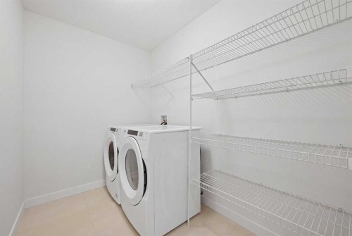 1448 Bayview Point Sw, Airdrie, AB - Indoor Photo Showing Laundry Room