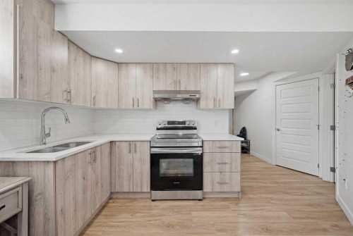 1448 Bayview Point Sw, Airdrie, AB - Indoor Photo Showing Kitchen With Double Sink