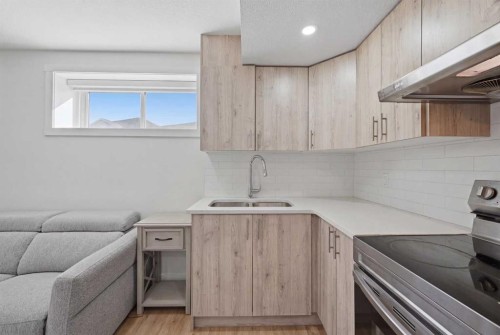 1448 Bayview Point Sw, Airdrie, AB - Indoor Photo Showing Kitchen With Double Sink