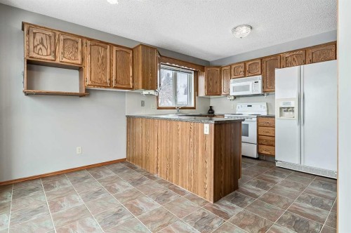 104 Macewan Meadow Way Nw, Calgary, AB - Indoor Photo Showing Kitchen