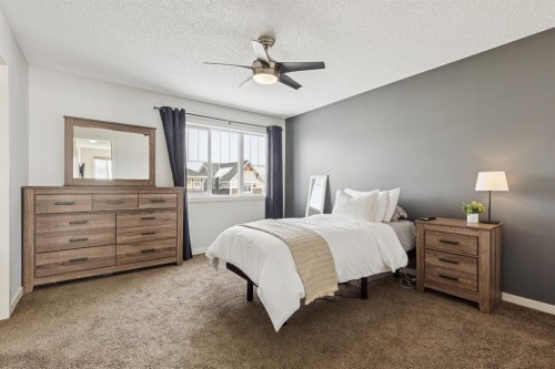 298 River Heights Crescent, Cochrane, AB - Indoor Photo Showing Bedroom