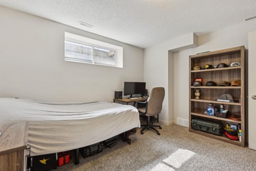 298 River Heights Crescent, Cochrane, AB - Indoor Photo Showing Bedroom