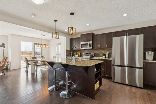 298 River Heights Crescent, Cochrane, AB - Indoor Photo Showing Kitchen With Stainless Steel Kitchen With Upgraded Kitchen