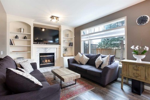 90 Discovery Ridge Road Sw, Calgary, AB - Indoor Photo Showing Living Room With Fireplace