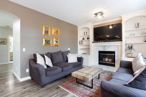 90 Discovery Ridge Road Sw, Calgary, AB - Indoor Photo Showing Living Room With Fireplace