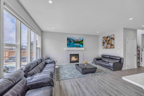 184 Cornerbrook Common Ne, Calgary, AB - Indoor Photo Showing Living Room With Fireplace